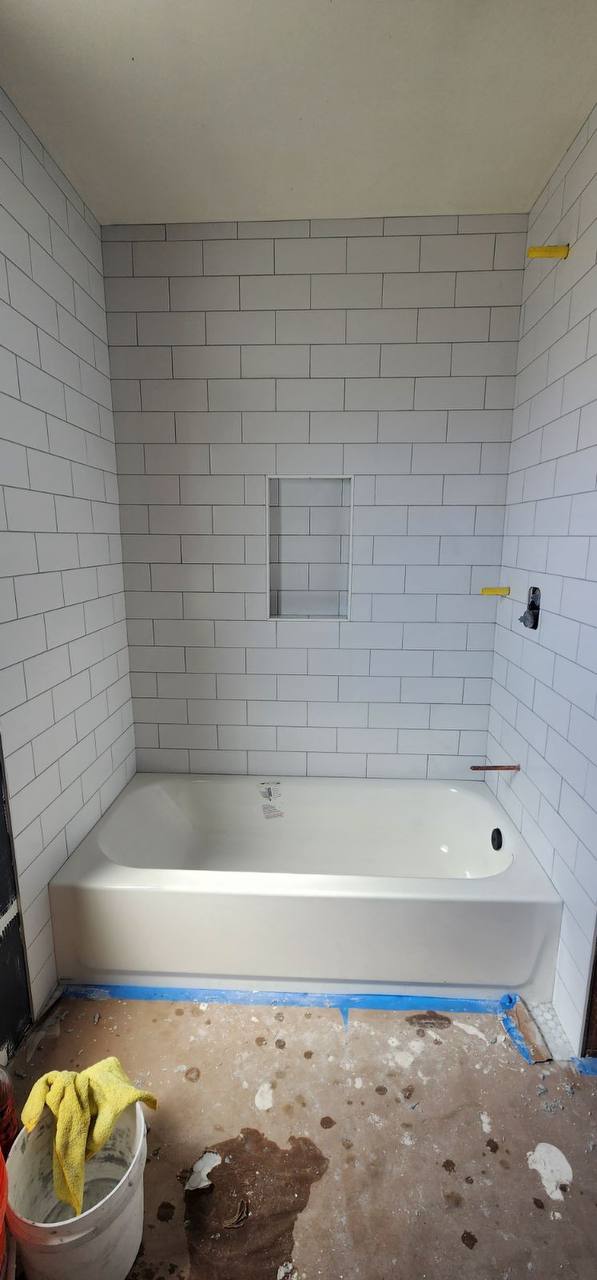 White subway tile tub surround completed install