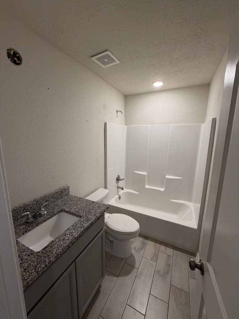 Bathroom 1 before — original shower stall