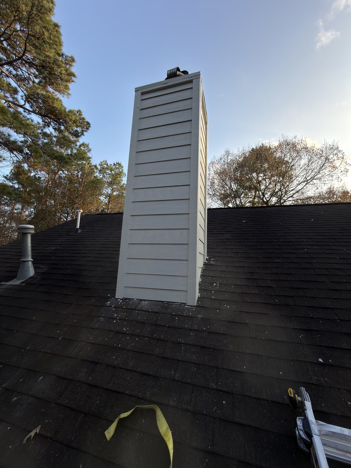 Wood rot repair completed — chimney siding restored, The Woodlands TX
