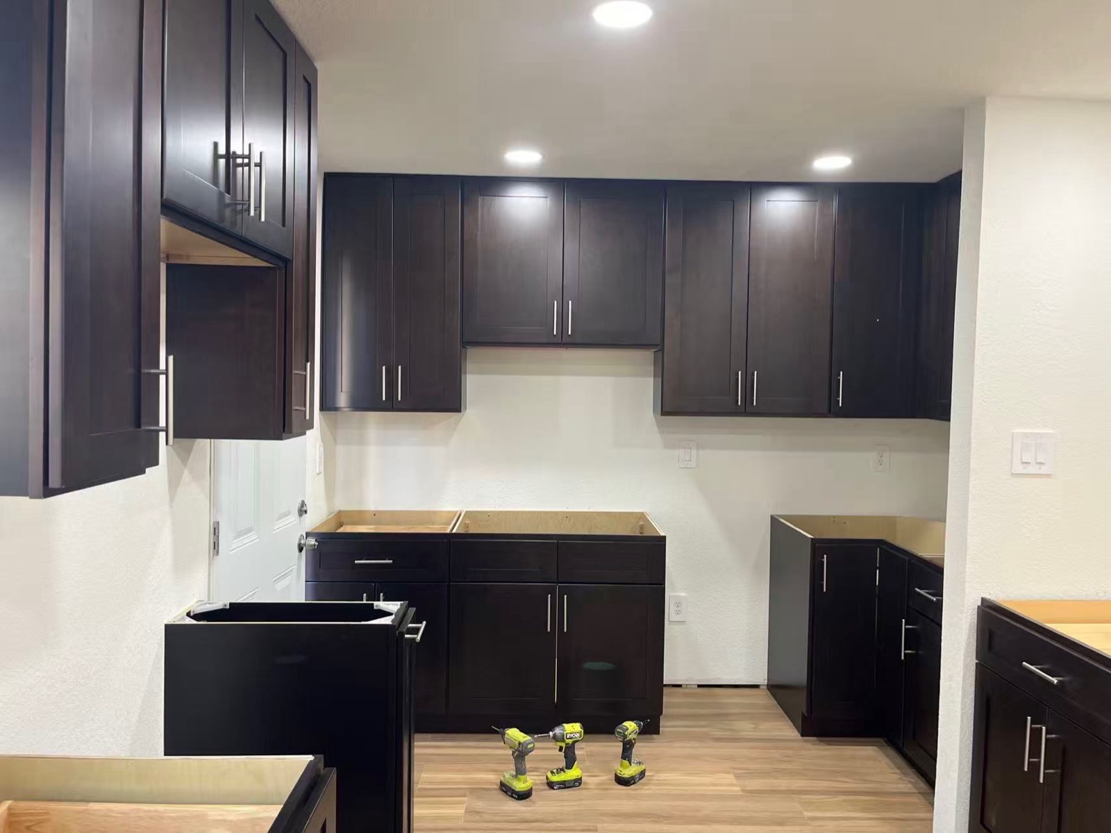 Espresso kitchen cabinet install — in progress