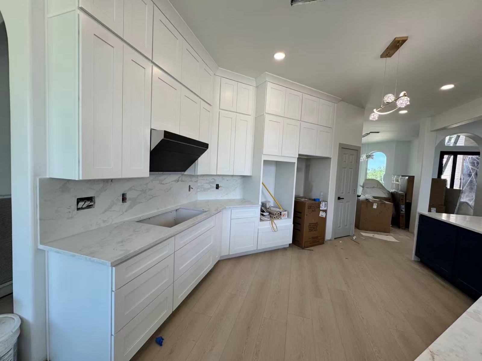 White shaker kitchen with marble backsplash — kitchen remodel in The Woodlands, TX