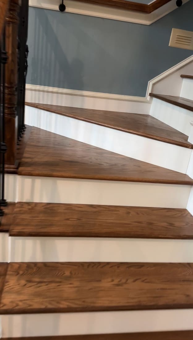 Completed stair run with stained handrail
