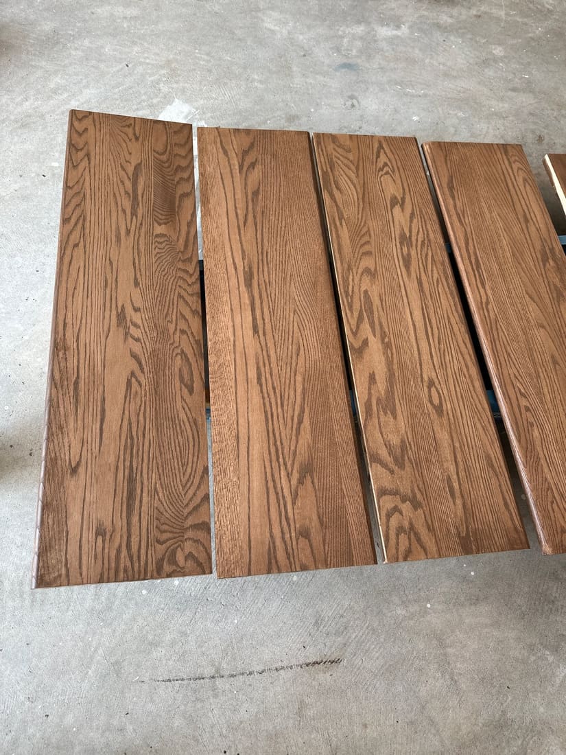 Old stairs — worn carpet treads, dated rail